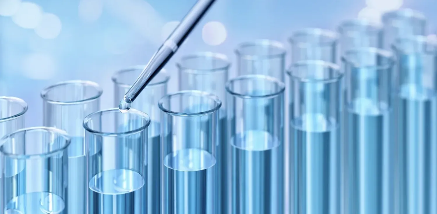 Laboratory test tubes with a pipette